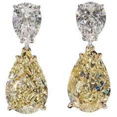 An impressive pair of diamond earrings! Each of the four diamonds are certified by GIA! 6.80 carats of Fancy Light Yellow diamonds, VS2. 2.01 carats of white, F color diamonds, SI1. 18k white and yellow gold Approximately .80 inches in length. Elegant and timeless these earrings were designed and made in New York. Tiny Diamond Earrings, Diamond Star Earrings, Yellow Diamond Earring, October Birthstone Jewelry, White Diamond Earrings, Yellow Diamonds, Opal Earrings Stud, Tiny Stud Earrings, Diamond Star