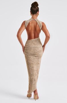 Crafted in our textured stretch fabric that hugs every curve, the Aphrodite midi features an asymmetric skirt with thigh high split. The high neck design is complete with a showstopping open back detail. Style yours with heeled mules and sleek waves. 



Colour: Beige.

Textured stretch fabric.



Open low back.

Asymmetric skirt.

Thigh high split.

Button closure at back neck.

High neck.

Midi length.

Model is an XS and is wearing an XS.

 Size: XS, S, M, L, XL, XXL Casual Outfits With Heels, Assymetric Dress, Sleek Waves, Homecoming Dresses Corset, Sensual Dress, Style Long Dress, Midi Dress Wedding Guest, Midi Dress Outfit, Asymmetric Skirt