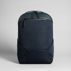 a blue backpack sitting on top of a white table