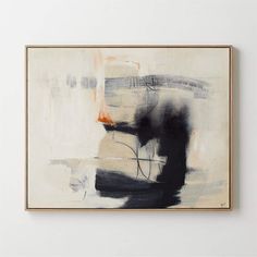 an abstract painting hangs on the wall