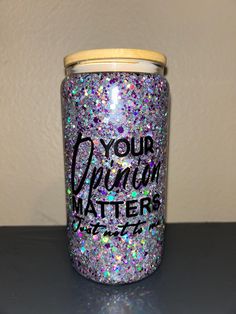 a glitter jar with the words your opinion matters on it