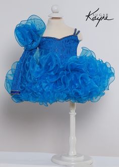 Make your little princess feel like the belle of the ball in the C218 - Sugar Kayne Kids Cupcake Dress! With its organza ruffled skirt and corset tie in the back, this dress brings sweet sophistication to any occasion. Ruffled organza skirt adds volume and flair Sweetheart neckline and corset tie create an elegant look Perfect for birthday parties, weddings, holidays, and more The voluminous ruffled skirt made of delicate organza fabric will have your daughter twirling with joy. The flattering s Elegant Fitted Ruffle Dress For Dress-up Occasions, Tulle Dress With Ruffles For Dress-up, Princess Dress With Sweetheart Neckline For Pageants, Pageant Princess Dress With Sweetheart Neckline, Princess Style Pageant Dress With Sweetheart Neckline, Tulle Pageant Dress With Sweetheart Neckline, Fitted Princess Dress With Ruffles, Organza Ball Gown With Sweetheart Neckline For Pageant, Tulle Princess Dress With Sweetheart Neckline For Pageants