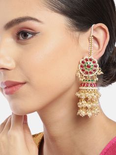 These gorgeous flower & dome shaped jhumka earrings come with magenta & green kundan stone studs and 3-layer off-white beaded danglers, are gold-plated, and secured with a post and back closure. Comes with beaded detachable ear chains. These handcrafted jhumkas can be styled with any traditional outfit, or an evening outfit to complete a captivating look. Product color may vary based on the monitor or screen you are using.See FAQ for more details. Size Length of earring: 8.5 cmLength of ear chai Jhumka Designs With Ear Chain, Festive Temple Jewelry Bridal Earrings With Dangling Beads, Kundan Dangle Jhumkas In Temple Jewelry Style, Kundan Jhumkas Temple Jewelry Dangle, Kundan Jhumkas Temple Jewelry Style, Kundan Chandbali Jhumkas With Dangling Beads, Kundan Temple Jewelry Danglers, Temple Jewelry Kundan Jhumkas, Traditional Kundan Chandbalis With Dangling Beads