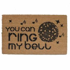 a door mat with the words you can ring my bell and a disco ball on it