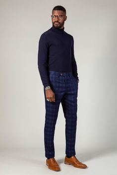 A blue and tan combination is a force to be reckoned with, and these Chigwell trousers are no exception. Featuring a timeless woven check in varying shades of blue and contrast tan buttons, they will make the perfect addition to your wardrobe. Cut to a slim fit, they define the leg to create a flattering silhouette. Model wears size 32R. Features Slim fit Hook bar & button fastening Two rear welt pockets Two front slash pockets Kick tapes Belt loops Flat fronted Style Tip | A fine knit navy roll Blue Business Pants For Fall, Classic Blue Winter Bottoms, Wedding Guest Suits, Tan Brogues, Check Trousers, Tan Belt, Checked Trousers, Blue Tweed, Wedding Guest Looks