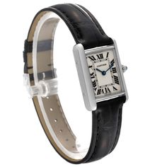 Cartier Tank Louis White Gold Black Strap Ladies Watch W1541056. Quartz movement. 18K white gold case 22 mm x 29 mm. Circular grained crown set with a blue sapphire cabochon. . Scratch resistant mineral crystal. Silver grained dial with black Roman numerals. Blued steel sword shaped hands. Black leather strap with 18K white gold tang buckle. Black Cartier Analog Watch, Cartier Black Analog Watch, Cartier Rectangular Analog Watch, Cartier Black Watch Accessories With Rectangular Dial, Classic Jewelry And Watches With Rectangular Dial, Classic Formal Watch With Rectangular Dial, Timeless Cartier Rectangular Watch, Cartier Timeless Rectangular Watch Accessories, Modern Cartier Rectangular Watch Accessories