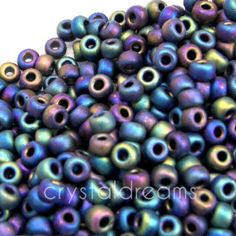 purple and blue beads are stacked on top of each other