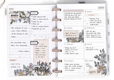 an open planner book with flowers on it