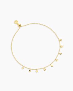 Elevate your bracelet look with the Chloe Mini Bracelet. This adjustable gold plated bracelet is perfect for layering and creating a sophisticated bracelet stack. Its dainty size is great for elegantly accessorizing any outfit. Delicate discs in our classic Chloe texture flutter across your wrist in this adjustable piece. Perfect to wear alone or layer with your other gorjana favorites. Elegant Adjustable Anklets For Everyday Wear, Delicate Adjustable Yellow Gold Charm Bracelet, Delicate Gold Charm Bracelet With Delicate Chain, Elegant Yellow Gold Anklets With Delicate Chain, Elegant Gold Anklets In 14k Gold Filled, Elegant 14k Gold-filled Gold Anklets, Elegant Adjustable 14k Gold-filled Anklets, Elegant Adjustable 14k Gold Filled Anklets, Elegant Adjustable Tarnish Resistant Anklets