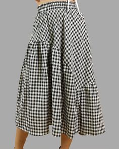 * A black and white checked skirt with elastic waist. * It is made of high end linen and cotton materials. * If you need to custom make the skirt waist and length, please contact us. * Support 7 days return to get full refund on item without any reason. * Can custom size and colors, lead time is 6-8 days; * Let us know your usual size in your country and your overall height. * If you have some specific request or special characters such as broad shoulder, long arms, long waist, etc you think we Casual Gingham Gathered Skirt, Gingham Tiered Skirt With Lining, Gingham Ruffled Tiered Skirt, Cotton Plaid Flared Skirt, Plaid Cotton Flared Skirt, Chic Gingham Tiered Skirt, Plaid Gathered Skirt For Summer, Chic Gingham Lined Skirt, Chic Long Plaid Skirt