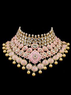 "Gulrukh Meenakari Bridal Set - Pink A pure hand-drawn detailed jewelry in the shades of soft pink and green meenakari work. This piece displays high-quality workmanship and fine usage of stones! This meenakari necklace set is perfect for western or traditional outfits. This set features a necklace with jadai detailing, featuring kundan chand motifs with lotus meenakari detailing. Delicate necklace accented with kundan stones and faux pearls creating a lush, sparkling set. The set includes a pai Chandbali Motifs Jewelry For Diwali, Traditional Meenakari Jewelry For Festive Occasions, Temple Jewelry With Motifs For Diwali, Ceremonial Multicolor Zari Work Jewelry, Heavy Multicolor Jewelry For Ceremonial Occasions, Designer Round Pink Jewelry, Designer Pink Round Jewelry, Bold Multicolor Ceremonial Jewelry, Ceremonial Kundan Jewelry With Motifs