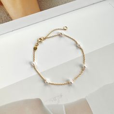 If you are interested in placing a bulk order (50+ pieces), please message us for special pricing.--Dainty pearl bracelet, gold pearl bracelet, minimalist chain bracelet, 925 sterling silver bracelet, pearl jewelry, bridesmaid gifts-- ► DETAILS  -925 sterling silver + white gold/14k gold -pearls -Length: 6 inches + 2 inches chain extender ►Heavenly Materials Our jewellery pieces are delicately handcrafted with gold-fill, sterling silver, stainless steel and gold-plating, combining rich, warm ton Minimalist Sterling Silver Pearl Chain Bracelet, Minimalist Sterling Silver Pearl Bracelet With Charm, Dainty Sterling Silver Bracelets With Pearl Charm, Dainty Sterling Silver Pearl Bracelet With Charm, Dainty Pearl Chain Bracelet, Dainty Sterling Silver Pearl Drop Bracelet, Minimalist Pearl Bracelet With Adjustable Chain, Delicate Sterling Silver Bracelet With Adjustable Chain, Dainty Chain Bracelet With Pearl Charm