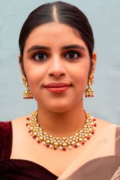 Exotic and snag-free kundan & ruby beaded necklace set with earrings. This is a stylish set with White Kundan. This set will work well with traditional, formal, and western formals. Eye-catching and unique jewelry that will set you apart. Gift this piece to a loved one, and see their face light up with joy. Best for gifting or for personal use, wear it to any occasion and become the spotlight. Elegant Dual-tone Kundan Necklace, Formal Jewelry Sets With Meenakari And Chandbali Shape, Formal Jewelry Sets Chandbali With Meenakari, Formal Kundan Necklace For Festivals, Formal Chandbali Kundan Necklace For Festivals, Formal Meenakari Jewelry Sets For Diwali, Formal Kundan Jewelry Sets Chandbali Style, Formal Kundan Jewelry Sets With Chandbali Design, Kundan Jewelry Sets With Cutdana