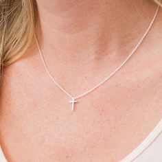 This tiny silver cross necklace is a classic addition to your layering necklaces. This minimalist necklace is also perfect by itself. The cross charm is sterling silver and measures approximately 12 mm in length or 1/2 inch. The chain is delicate looking but sturdy sterling silver. This dainty cross necklace is available in lengths from 15 - 18 inches. You may choose to add an attached extender. Your new necklace will come in a box, ready for gift giving. More Christian jewelry https://www.etsy. Simple Everyday Cross Jewelry, Delicate Everyday Cross Necklace, Simple Cross Clavicle Chain Jewelry, Simple Clavicle Chain Cross Jewelry, Dainty Cross Necklace For Everyday Wear, Minimalist Hypoallergenic Cross Jewelry, Minimalist Cross Pendant Necklace For Everyday, Simple Cross Jewelry With Delicate Chain, Simple Necklace With Delicate Chain And Cross Pendant