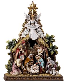 a nativity scene with angels and baby jesus in the manger, surrounded by other figurines