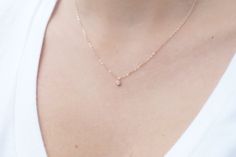 "Our CZ Tiny Rose Necklace is so petite and feminine! The sparkling cubic zirconia charm hangs from a 14K gold or rose gold filled chain. This is the perfect gift for a friend as it is so dainty and ready for everyday wear. ---------------------- FEATURES ◊ Tiny Cubic Zirconia charm (4mm x 7mm) ◊ 14K gold filled or rose gold filled chain ◊ Model is wearing 17\" length ◊ All necklace findings (clasp, jump rings, tag) & chain are 14K gold filled to ensure the highest quality piece ------------ Dainty Rose Gold Necklace, Danty Necklace, Girlfriend Necklace Gift, Rose Gold Choker, Gold Necklace Dainty, Floating Diamond Necklace, Dainty Rose, Crown Necklace, Dainty Gold Necklace