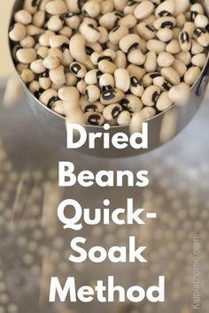 a metal bowl filled with black and white beans