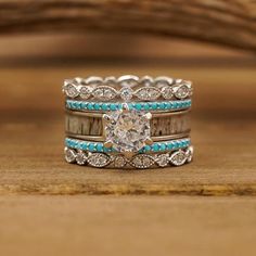 From the moment this ring was released, it has been one of our most popular sets! This elegant bridal set is the perfect complement to her modern style. Designed and framed by a gorgeous all-natural antler grain inlaid engagement ring, topped with a round Cubic Zirconium stone. With the twisted look of the Vintage Stacking Rings and Turquoise Rose Atoll rings, this bridal set honors your unique love. With high demand, The Magnolia Springs is one of our personal favorites and has been a best-sell Antler Rings, Western Wedding Rings, Antler Wedding Band, Western Themed Wedding, Antler Ring, Wedding Bands For Her, Wedding Vow, Stacking Bands, Wedding 2024