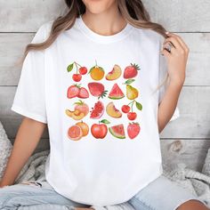 ✨ Vintage Fruit Tee SHIRT ✨This is a unisex Comfort Colors 1717 shirt ✨100% ring-spun cotton ✨ Medium fabric (6.1 oz/yd² (206.8 g/m ✨ Runs True To Size ✨ Made, Packaged and Shipped in the USA 📏 SIZING  Please refer to size chart on the listing photos for a detailed sizing chart with measurements.  Unisex sizing.  If you are seeking an oversize look be sure to order 1 to 2 sizes up from your regular size.  Since all shirts are made to order, sizing issues will not be refunded. ❤️ CARE Taking car Casual White Tops With Fruit Print, White Casual Fruit Print Top, White Casual Top With Fruit Print, White Cotton Shirt With Fruit Print, White Summer Shirt With Fruit Print, White Fruit Print Shirt For Summer, Summer White Shirt With Fruit Print, Short Sleeve Cotton Shirt With Fruit Print, White Shirt With Funny Print And Relaxed Fit