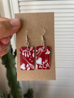 Fun handmade earrings featuring a red & white print  ❤️ made from recycled biscuit tins they're sustainably sourced & very lightweight! - 925 silver plated steel hooks - Size: 2x3.5cm Check out more of my earrings here: https://gracenicolexx.etsy.com **Please note that all of my items are handmade from recycled materials so please allow for small imperfections and slight variations in patterns & size** How To Make Recycled Tin Earrings, Traditional Red Enamel Earrings, Upcycled Tin Earrings, Unique Red Enamel Earrings, Artisan Red Nickel-free Earrings, Handmade Earrings, Print Making, Red And White, Halloween Shopping