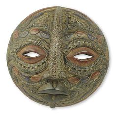 an ornate mask is shown on a white background