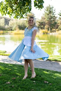 Whether you're attending a themed party or embracing your inner princess on a special occasion, our Twirling Cinderella Dress is sure to make you feel like the belle of the ball. Designed for twirling - cut from a full circle of fabric which allows it to billow out as you spin Elegant white puff sleeve to add both charm and comfort Classic white peplum for that timeless Cinderella feel Made from breathable, stretchy, mid-grade soft knit fabrics Accessories Sold Separately Fitted Princess Dress For Garden Party, Fitted Princess Fairy Dress For Garden Party, Fitted Fairytale Princess Dress For Spring, Fitted Fairytale Dress For Themed Events, Princess Style Fitted Dresses For Themed Events, Snow White Fitted Wedding Dress, Spring Costume Party Dresses With Full Skirt, Spring Full Skirt Dresses For Costume Party, Cinderella Dress