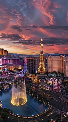 the eiffel tower is lit up at night in las vegas, nv