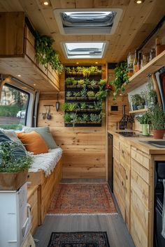 the interior of a small home with plants in it