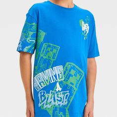 Your kid will love repping their favorite game wherever they go with this Minecraft Graffiti Short-Sleeve Graphic T-Shirt. This royal blue graphic T-shirt features Minecraft Creeper graffiti in green hues at the front along with the text "Having a blast," and "Creep" in graffiti-style white text for a fun look. Made from a cotton-blend fabric in a standard-fit cut, this tagless T-shirt offers comfort all-day cool comfort. Minecraft Graffiti, American Shorts, Blue Graphic, Green Hues, Kids Clothes Boys, Graffiti Styles, Top Graphic Tees, Light Blue Denim, Having A Blast