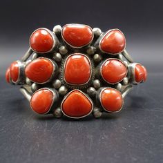 "VERDY JAKE (NAVAJO) BRACELET DESCRIPTION: This breathtaking cuff is from celebrated Dine' artisan Verdy Jake. Plump specimens of old red Mediterranean coral are set in heavy gauge sterling silver. This exqisite bracelet will be a cherished addition to your collection of fine vintage Native American jewelry. MEASUREMENTS: Interior of the cuff measures 5 3/8\" with an additional 1 1/8\" non-adjustable gap. Total circumference: 6 1/2\" Measures 2 1/4\" straight across the widest part (from wrist b Jewelry Measurements, Bones Bracelet, Vintage Native American Jewelry, Navajo Bracelet, Vintage Navajo, Coral Turquoise, Denver Co, American Jewelry, Natural Turquoise