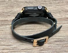 Make a Fashion Statement Every Place You Go! Get Tons of Compliments Wearing Your Beautiful Bracelet BE DIFFERENT! BE UNIQUE Double Wrap 7mm Genuine Leather Strap with Adjustable Buckle Designed And Handmade by Simeon D Jewelry Studio Adjustable Size Bracelet Perfectly Tailored to Fit Your Wrist This Bracelet Fits ALL Apple Watch Series Not For Other Models. Apple Watch Is NOT Included Follow my Studio on Social Media for Updates & New Designs Adjustable Leather Strap Apple Watch Band, Adjustable Wrist Strap Watch Bands, Adjustable Leather Strap Watch Accessories, Gold Rectangular Leather Strap Apple Watch Band, Gold Rectangular Apple Watch Band With Leather Strap, Gold Rectangular Leather Apple Watch Band, Luxury Adjustable Black Apple Watch Band, Adjustable Bracelet Strap Apple Watch Band, Gold Leather Strap Apple Watch Band Gift