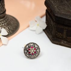 This ring is made in 925 Sterling silver with pink and white kemp stone. This is an adjustable ring will looks good with all casual and occasional outfits. Pair it with any floral outfit and add a dash of exuberance to your look. This piece has been delicately handcrafted by skilled craftsmen who are carrying forward and sharing the Traditional Mughal art of Jewelry making with the entire world. Gross Weight: 13.00 gms Packaging and Shipping Your item is packed very carefully to avoid any in-tra Ceremonial Multi-stone Ring Jewelry, Ceremonial Multi-stone Jewelry Ring, Temple Jewelry Style Ruby Wedding Ring, Wedding Temple Jewelry Ruby Ring, Temple Jewelry Style Hallmarked Round Ring, Temple Jewelry Rings Hallmarked, Temple Jewelry Rings As Gift, Fusion Style Rings With Intricate Design As Gift, Silver Filigree Ring With Stone Setting For Wedding