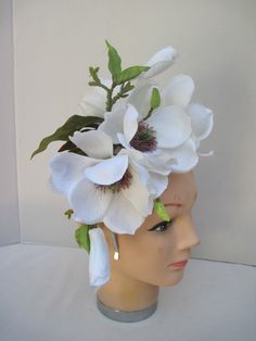 * This Magnolia headpiece has been designed on a high polish silver metal headband that is comfortable and will fit any head size. * The design has open Magnolia flowers along with buds and opening blossoms. * It can be worn all year round and for varied occasions. * All of the design is secure, evenly balance and comfortable to wear and will fit any head size. * Great to wear to Diner en Blanc, weddings, various showers, birthday celebrations, tea parties, dinner engagements, Horse Race Events, White Flower Headpiece For Garden Party, White Headband For Garden Party, White Flower Headpieces For Garden Party, Elegant Flower Headpieces For Spring, Spring Headpiece With Adjustable Pinched Crown, White Floral Headpieces For Spring, White Handmade Flowers Headband For Spring, White Flower Fascinator For Spring, Adjustable White Flower Hair Accessories