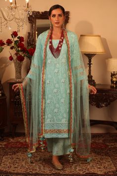 Bluish green kurta highlighted with intricate chikankari-hand embellishments, round neckline and straight silhouette. Comes with pant and dupatta.
Components:3
Embroidered
Neckline:Round
Sleeve Length:Three Quarter
Fabric:Georgette, Sheer Net
Color:Blue
Embroidered pant
Embroidered dupatta with tassels - Aza Fashions Designer Turquoise Sets With Resham Embroidery, Designer Green Salwar Kameez With Chikankari Embroidery, Turquoise Sharara With Resham Embroidery For Eid, Designer Unstitched Green Suit With Chikankari Embroidery, Unstitched Turquoise Salwar Kameez With Resham Embroidery, Turquoise Kurta With Dabka Work For Eid, Turquoise Kurta With Resham Embroidery For Eid, Turquoise Resham Embroidered Kurta For Eid, Green Unstitched Suit With Dupatta For Reception