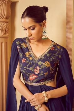 Blue draped, padded saree gown with floral printed bodice and cascading sleeves. - Aza Fashions Blue Dresses With Draped Sleeves For Festive Occasions, Festive Blue Dresses With Draped Sleeves, Festive Blue Dress With Draped Sleeves, Festive Fitted Gown With Draped Sleeves, Blue Wedding Dress With Draped Sleeves, Draped Saree Gown, Gowns Blue, Saree Gowns, Draped Saree