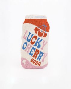 a close up of a can cooler cover on a white background with the words lucky cherry soda