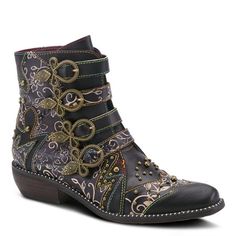 a woman's black boot with gold chains and flowers on the side, in leather