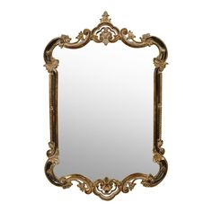 an ornate gold framed mirror on a white background