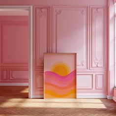 an empty room with pink walls and wooden floors