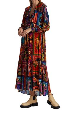 This button-front ankle dress features a ruffled neckline and bold print inspired by the vibrant colors and culture of Farm Rio's home city, Rio de Janeiro.V-neckLong sleevesSmocked cuffsButton-front closure100% rayonLining: ViscoseMachine wash Traditional Multicolor V-neck Maxi Dress, Multicolor Folk Dress With Boho Print, Bohemian Long Sleeve Maxi Dress With Abstract Print, Multicolor Folk Style V-neck Dresses, Multicolor Printed Maxi Dress For Fall, Multicolor Boho Print Maxi Dress For Fall, Bohemian Multicolor Print Midi Dress, Multicolor Long Sleeve Peasant Dress, Bohemian Multicolor Pattern Midi Dress