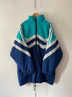 DOPE VINTAGE ADIDAS STUFF TECHNICAL  in very good condition STREETWEAR JACKET size: suits MEN oversized L/XL or oversized XL/2XL women (Note: we only have ONE piece in stock. If more than one size is mentioned, it means this item will work on a range of sizes.) * PRODUCT SIZES: * VINTAGE CUT SO ONLY THESE TWO RELEVANT FOR MEASUREMENT - height                                   84 cm  / 33.071in - outer sleeve                        84 cm /  33.071in Great condition!  ✈️        FAST SHIPPING with DHL EXPRESS! ☎️+ 💌 Provide phone no and email for DHL courier to have a smooth shipping. We deliver worldwide with DHL Express. ▪️ European countries         1-2 days ▪️ Canada/US/Japan/etc.    3-5 days  🟥  Returns & Exchange Policy We accept returns only after you receive the parcel and just in t Blue Oversized Sports Outerwear, Oversized Blue Sports Outerwear, Blue Oversized Outerwear For Sports, Oversized Blue Outerwear For Sports, Adidas Retro, Retro Soccer, Suits Men, Adidas Vintage, Long Jacket