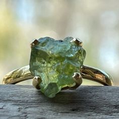 Gemstone: Green Apatite Rough Metal: 18k Gold Vermeil (925 Marked) Ring Size: 9 3.2 Grams Total Weight Brand New, Only Worn For Pictures 18k Gold Vermeil Is Vermeil That Has Been Plated With A Thick Layer Of 18k Gold Over A Sterling Silver Base. After Solid Gold, Gold Vermeil Is The Highest Quality Type Of Gold Tone Jewelry That You Can Buy. It Is A Great Option For Those Who Are Seeking An Affordable And High Quality Alternative To Solid Gold Jewelry. (Please Excuse The Bizarre Coloring Of My H Wedding Ring Earthy, Vintage Green Rings, Raw Gemstone Ring Engagement, Raw Rock Engagement Ring, Emerald Cut Peridot Gemstone Jewelry, Tourmaline Birthstone Ring In Yellow Gold, Yellow Gold Tourmaline Birthstone Ring, Green Citrine Rings With Accent Stones, Green Citrine Gemstone Rings