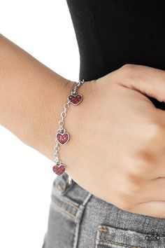 Encrusted in glassy red rhinestones, dainty silver heart charms dangle from the wrist, creating a flirtatious sparkle. Features an adjustable clasp closure. Sold as one individual bracelet. P9RE-RDXX-112XX Valentine Vibes, Sparkly Fashion, Haute Jewelry, Valentines Bracelets, Red Bracelet, Feeling Pretty, Red Bracelets, Bracelet Online, Paparazzi Accessories