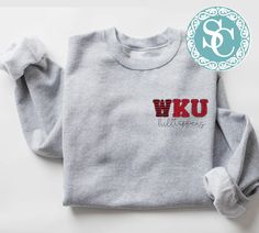 Western Kentucky Hilltoppers shirt!  Unisex Sizing!  The sweatshirt listed has the design on a sport gray shirt (1st photo), but we can also do on a different color sweatshirt!  For an option not listed, send us a message!  🔹T SHIRTS🔹 Adult S-XL Adult 2X Adult 3X 🔹LONG SLEEVE & SWEATSHIRTS🔹  Adult S-XL  Adult 2X Adult 3X If you would like to request a custom order,   please send us a message! Gray Crew Neck Top For Campus, Sporty Heather Grey Tops For College, College Heather Grey Tops With Letter Print, Heather Grey Letter Print Top For College, Gray Varsity Top For College, Wku Hilltoppers, Game Day T Shirt, Kentucky Shirts, Message T Shirts