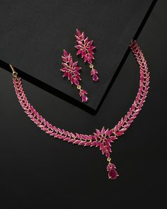 * CZ zirconia necklace and a pair of earrings * Pink gold-plated American diamond studded leaf shaped necklace, has a hook closure * A pair of matching drop earrings, secured with post and back closure *Size:- Length of necklace: 41 cm Length of earrings: 4.5 cm *Material:- Material: Brass Plating: Gold-Plated Stone Type: CZ, Zircon American Diamonds NOTE All the raw material used in this product is of high quality and is handcrafted with love. Premium Quality and High craftsmanship 100% Satisfa Ruby Pendant Indian, Ruby Necklace Indian Gold, Ruby Jewelry Necklaces Gold, Ruby Necklace Indian, Ruby Gold Necklace, Ruby Necklace Gold, Ruby Choker, Emerald Diamond Necklace, Ruby Necklace Designs