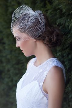 a woman with a veil on her head