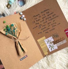 a handmade greeting card with flowers on it, and a message written in cursive writing