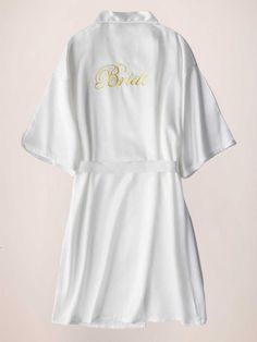 This elegant satin morning robe is a must-have for any bride. With its elegant sleeves and luxurious fabric, it's perfect for getting ready on your special day. Feel comfortable and stylish while you prepare to walk down the aisle. Start your wedding day off right with this beautiful robe.

Material: Polyester Fiber (Polyester)
Sleeves: Short SleevesClosure: Front ClosureNote: Final Sale & No Returns Elegant Long Sleeve Robe For Bridal Shower, White Satin Wedding Dress For Bride, Elegant Satin Bridesmaid Robe, White Robe For Mother Of The Bride, Wedding Satin Robe, Satin Wedding Robe, White Satin Honeymoon Robe, Long Sleeve Satin Wedding Robe, White Satin Wedding Robe