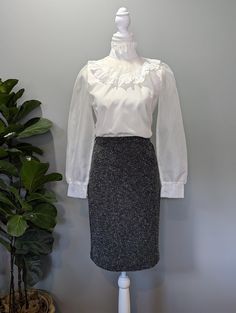 **Made in Canada** This high waisted, mixed gray, Joseph Ribkoff skirt is the epitome of stylish comfort. The stretchy material hugs your curves, while allowing plenty of movement. An ideal piece to wear for work and going out! Excellent condition, no stains or damage. Tag says size 8, stretch likely allows for modern US women's size 6-10 or S-M. Please remember to take your measurements. Vintage sizing may vary greatly! Waist: 26" (elastic) Hips: 36" Length: 23" Sweep/Hem: 36" Gray Fitted High Waist Mini Skirt, Gray High Waist Skirt For Work, Elegant High Waist Gray Skirt, Fitted Fall Pencil Skirt For Office, Fitted Pencil Skirt For Office Wear In Fall, Fall Pencil Skirt For Office Wear, Elegant Gray Pencil Skirt, Fall Office Skirt With Stretch, Fall Office Skirt Stretch