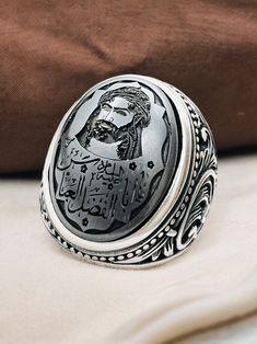 Islamic Arabic Carving Natural Hadid sini Hematite Hz Abbas, 925 silver Ring,Shia,Ahlulbeyt ابو الفضل العباس Stone size is 15x20mm Back of ring is open to touch the stone Islamic Scraping,Islamic Men's Ring,Islamic Carving,Islamic Gift for Men,Islamic Unique Gift,Islamic Ring Gift,Silver Men's Ring Handmade Silver Ring,Father's Day Gift,Best Gift for Man,Gift for Muslim Men,Gifts for Boyfriend,Gifts for Dad,Gifts for Girlfriend,Gifts for Husband,Gifts for Mom,Gifts for Sister,Gifts for Wife,Anni Artisan Silver Engraved Ring, Artisan Silver Engraved Ring With Carved Details, Father Christmas Gifts, Gifts For Sister, Mens Silver Rings, Islamic Gifts, Silver Rings Handmade, Silver Man, 925 Silver Rings